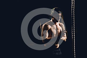 Athlete doing Fitness Rope Climb Exercise In Fitness Gym Workout