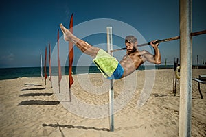 Athlete doing pull-up on horizontal bar