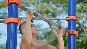 Athlete Doing Pull-up On Horizontal Bar