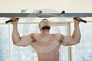 Athlete doing pull-ups