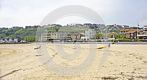 Athlete dragging kayak in Suances in the autonomous community of Cantabria photo