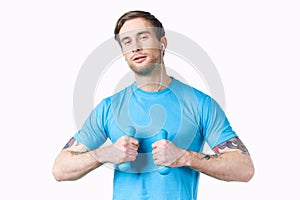 athlete with dumbbells doing exercise fitness pumped up arm muscles tattoo