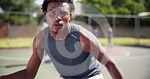 Athlete, face and ball on basketball court for fitness, dribbling exercise and training with team in outdoor. Black man