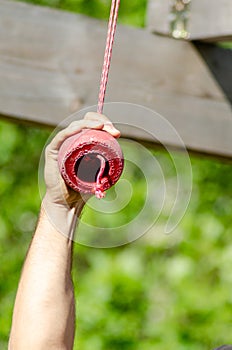 an athlete hand at a hanging obstacle at an obstacle course race, OCR photo