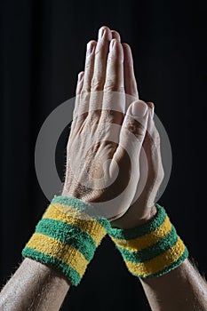 Athlete Hands Wearing Brazil Wristbands Praying