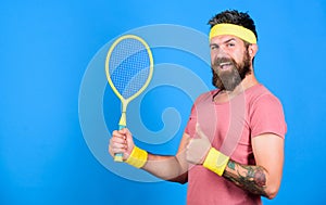 Athlete hold tennis racket in hand on blue background. Tennis sport and entertainment. Tennis club concept. Man bearded