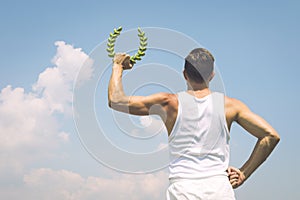 Athlete Holding Laurel Wreath Blue Sky
