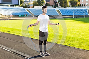 Athlete indian man doing exercize at the stadium