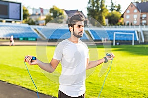 Athlete indian man doing exercize at the stadium