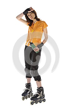 Athlete with inline skates drinking water