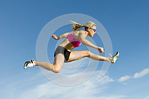 Athlete Jumping Against a Sky Backdrop