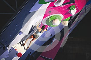 Athlete jumping on the final route of the IFSC lead world cup