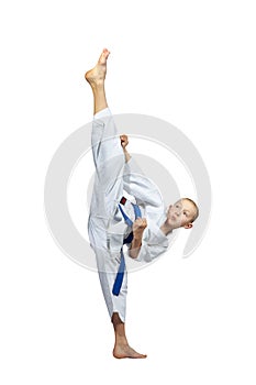 Athlete in karategi is training hitting ura-mavashi geri