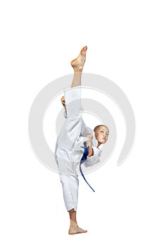 Athlete in karategi is training hitting ura-mavashi geri