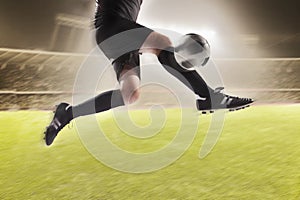 Athlete kicking a soccer ball