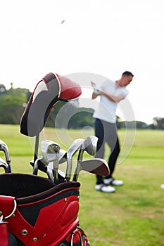 Athlete, man and club on golf course for swing, player and training in professional sport on field. Golfer, learning or