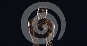 Athlete, muscle or face of strong man in studio with pride for fitness or wellness on black background. Flexing, happy