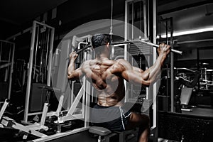 Athlete muscular bodybuilder training in the gym