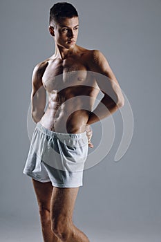 athlete muscular torso nude muscles bodybuilder fitness gray background