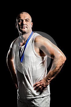 Athlete with olympic gold medal around his neck