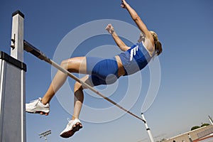 Athlete Performing High Jump photo