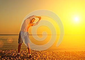 Athlete , playing sports and yoga on beach