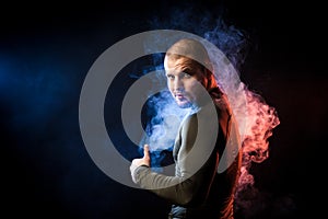 Athlete posing against smoke