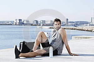 Athlete resting by sea