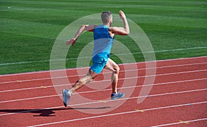 athlete runner do aerobic or anaerobic load. man start running on stadium. fitness gym outdoor. muscular athletic runner