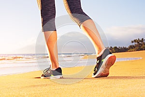 Athlete runner feet on the beach