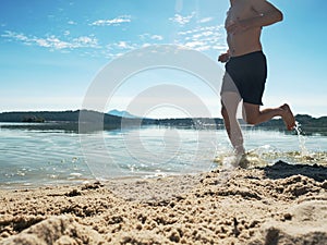 Athlete runner running in water with heart rate monitor