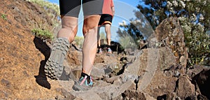 Athlete running sport feet on trail, selective focus on sole