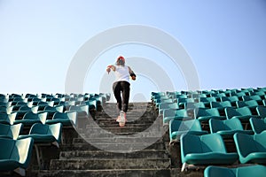 Athlete running on stairs. woman fitness jogging workout wellness concept