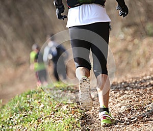 Athlete runs on the trail on mountains