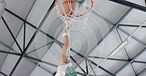 Athlete scoring during a basketball game, with copy space