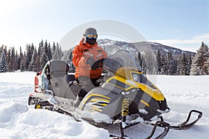 Athlete on a snowmobile.