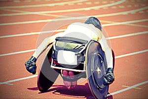 athlete on special wheelchair on the sport venue