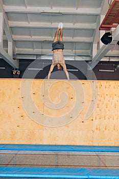 Athlete with strong arms performs at gym