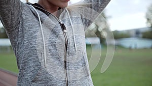 The athlete tied her hair in the tail. Running Women tying up hair before run