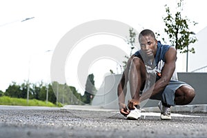 Athlete ties his shoe laces