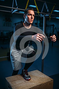 Athlete on training, endurance exercise with box