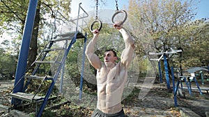 Athlete trains on the rings.