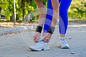 Athlete tying her laces