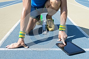 Athlete Using Tablet on the Track