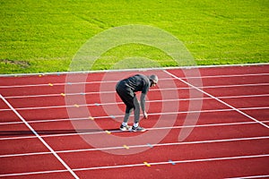 An athlete warming up for running practice at the Parliament Hill athletics track in Hampstead Heath