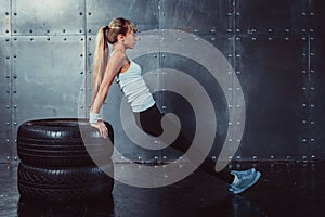 Athlete woman doing push-ups on bench training