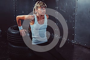 Athlete woman doing push-ups on bench training