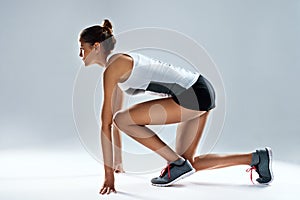 Athlete, woman and runner start in studio for wellness, fitness and sprint on mockup space. Training, workout and female