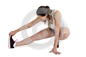 Athlete woman stretching her hamstring