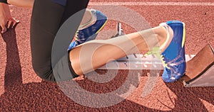 Athlete woman waiting in the starting block